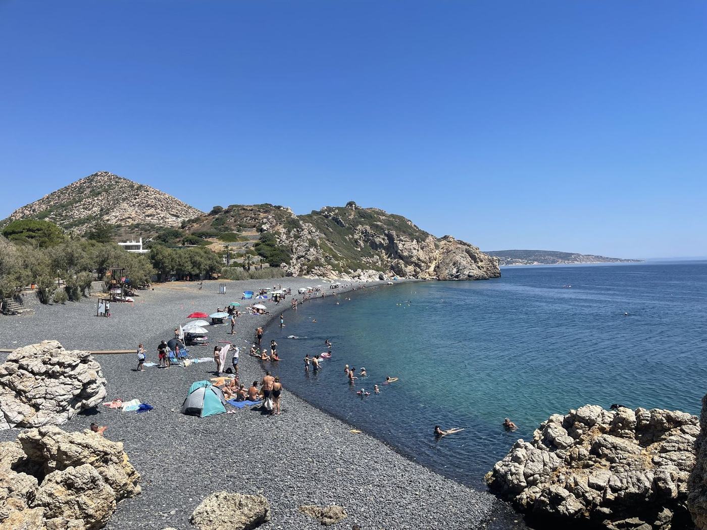 Pebble cove with swimmers