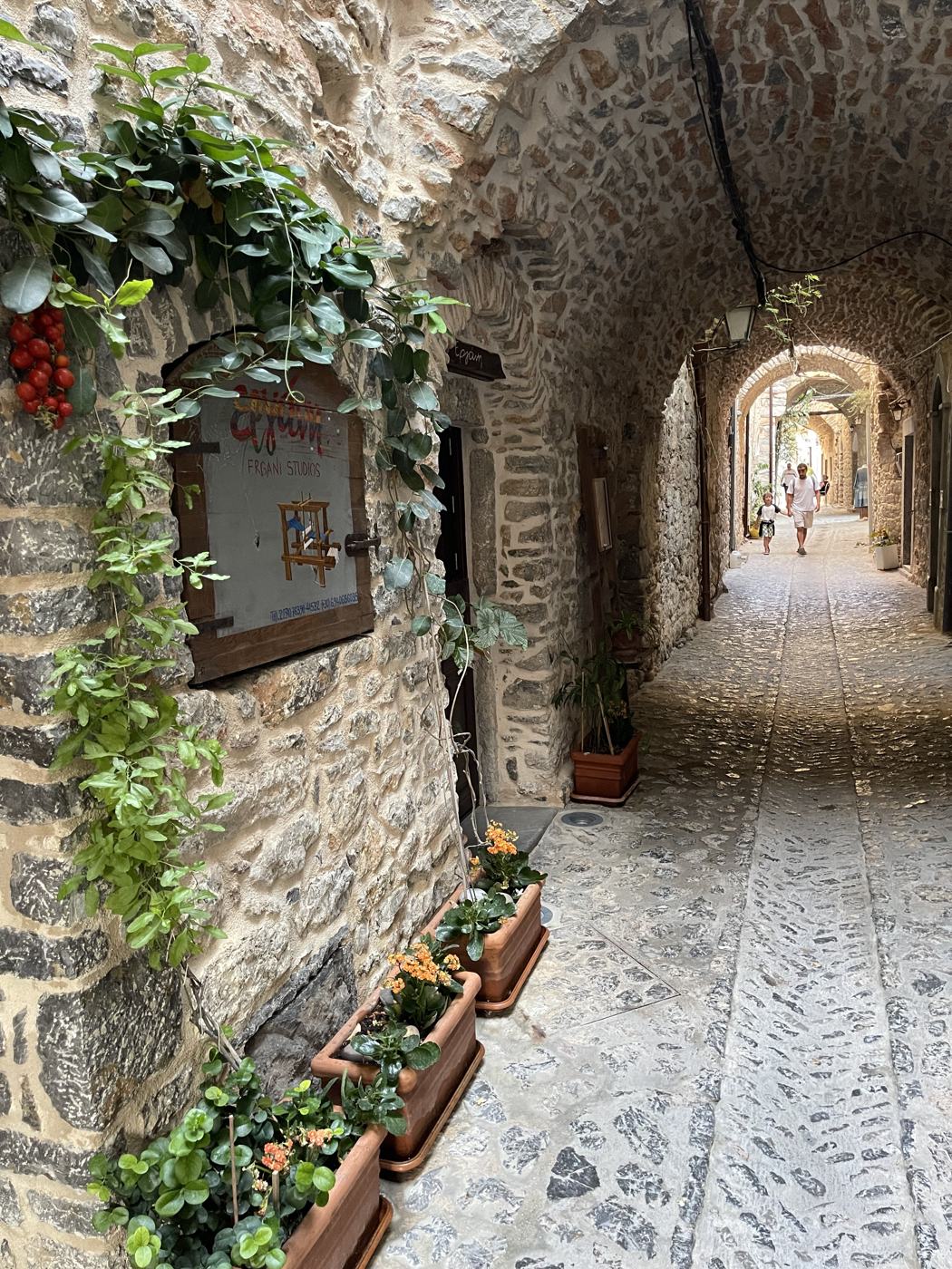 Cafe tables in a village lane