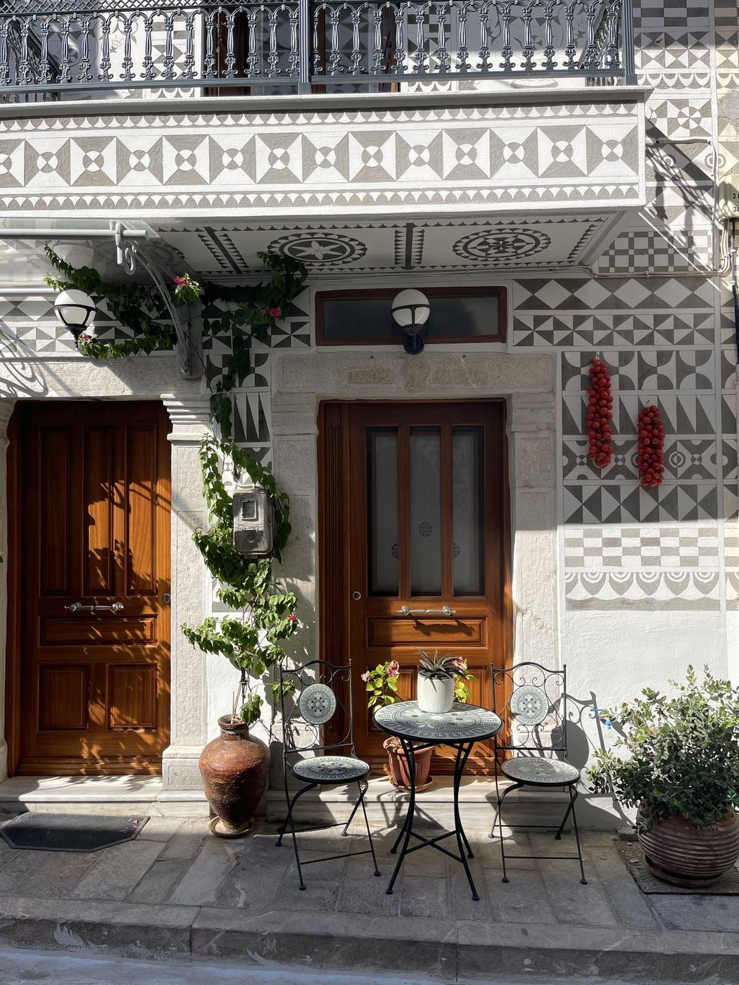 Doorway with cafe table and tomatoes