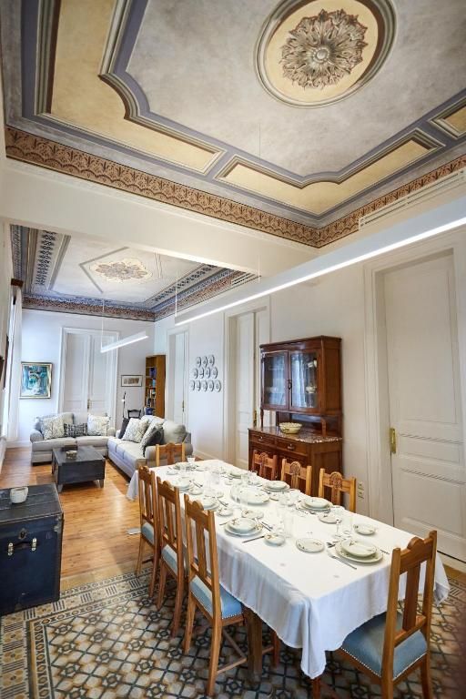 Dining room beneath a painted ceiling